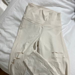 Alo hemmed distressed cream leggins